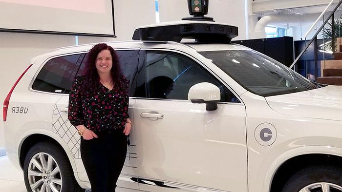 Courtney Bailey with a self-driving Uber vehicle