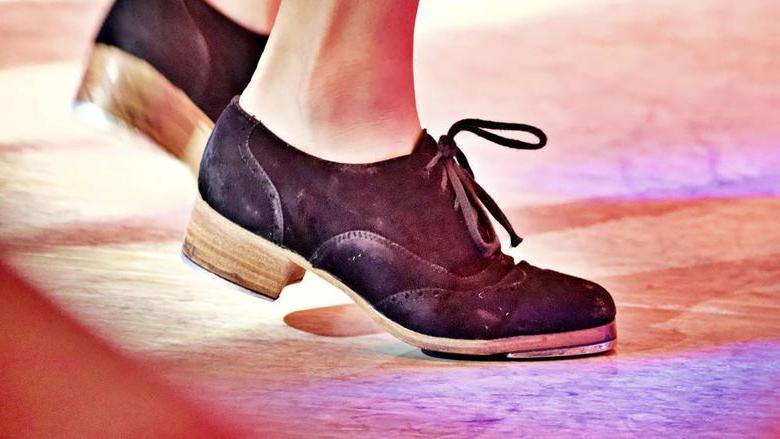 a close up of tap shoes dancing